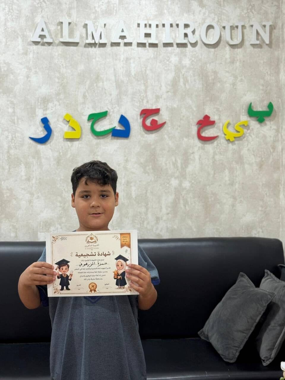 Student holding recognition diploma