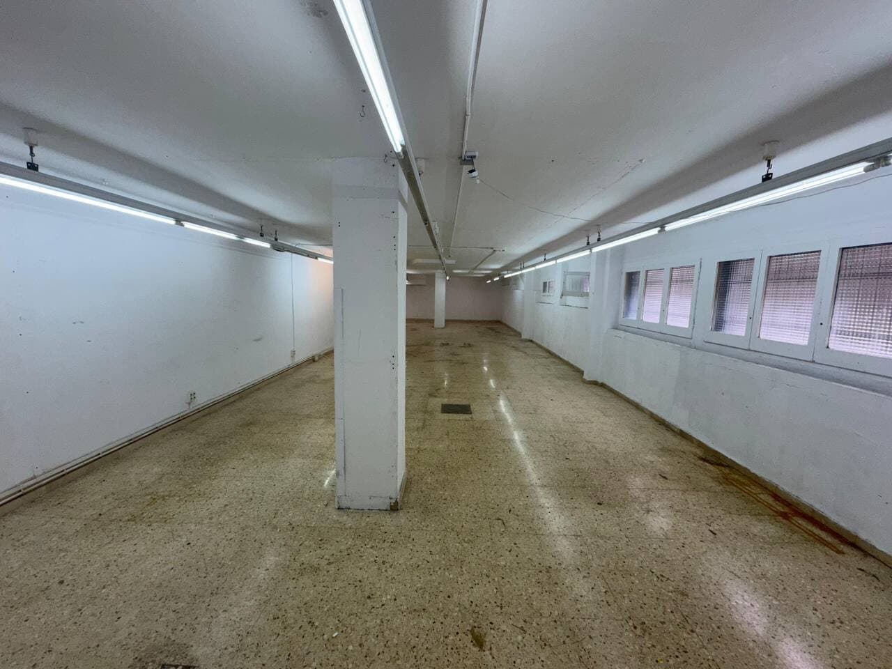 Long open expansion room with windows